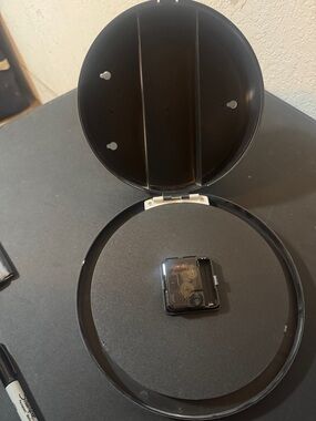 Clock with hidden compartment